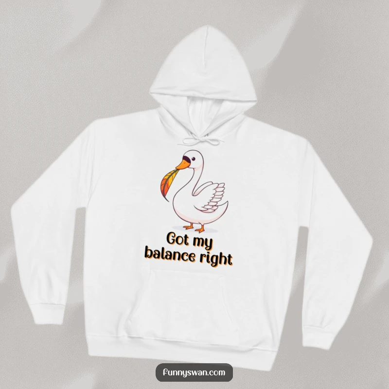 Funny Swan Hoodie: A happy swan maintains perfect balance with a colorful feather perched on its beak.